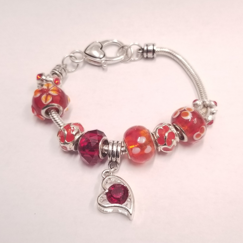 Heart themed charm silver bracelet